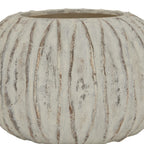 Front detail of the vase's broad ribs and mottled white finish, with the gently undulating rim visible above.