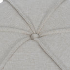 Close-up of the linen-covered top button, surrounded by radiating piped seams and textured oatmeal fabric.