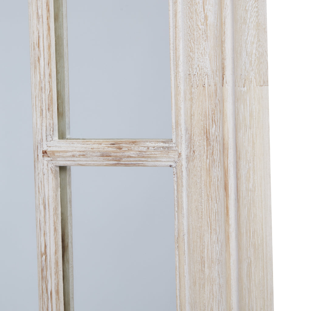 Detail of the mirror's right-hand border, with a horizontal divider between mirrored sections beside the broad pale washed outer frame.