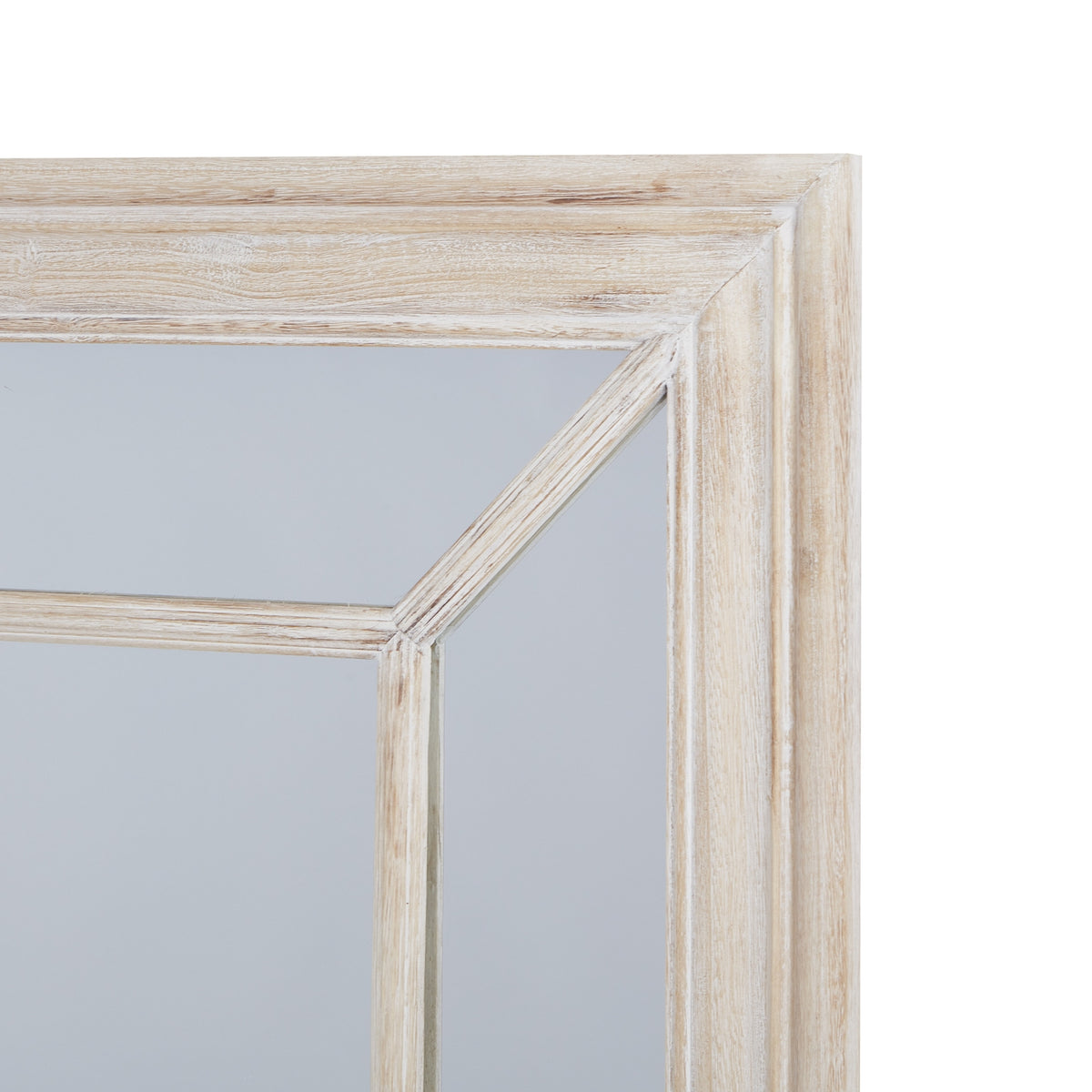Upper right corner of the mirror showing the stepped pale frame and diagonal division between mirrored border panels.