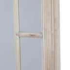 Close-up of a horizontal divider in the mirror's side border, beside the pale frame with warm beige streaks.