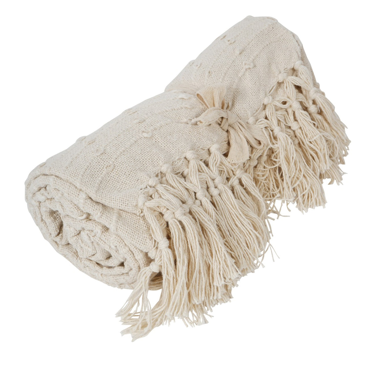 Cream throw rolled and tied with a fabric ribbon, showing raised loops and long knotted tassels.