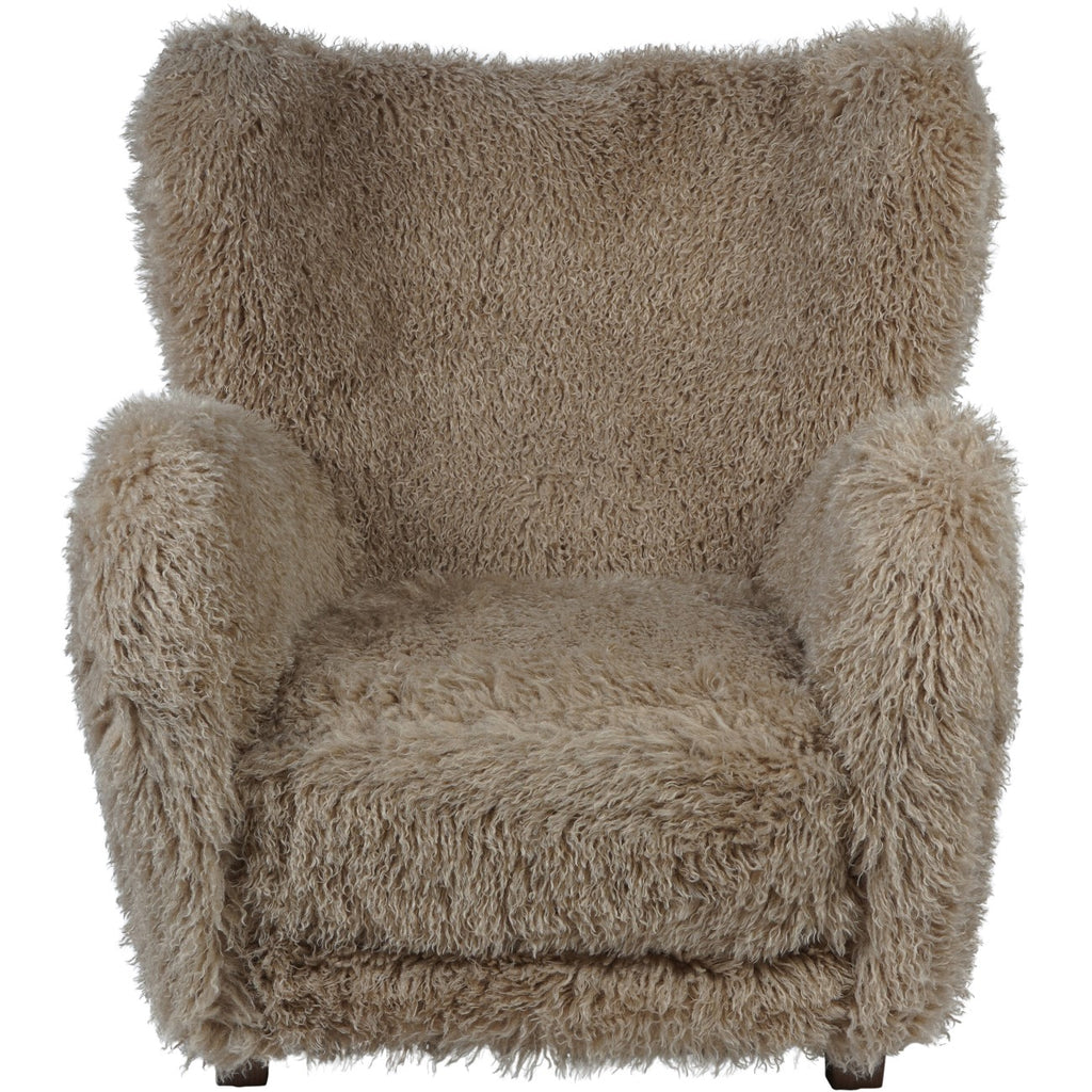 Front view of the shaggy beige armchair showing its wide seat, rounded arms and curved upper back.