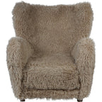 Front view of the shaggy beige armchair showing its wide seat, rounded arms and curved upper back.