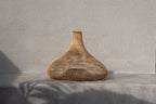 Shala Rattan Pendant Light – Natural, Large – styled against a textured grey wall