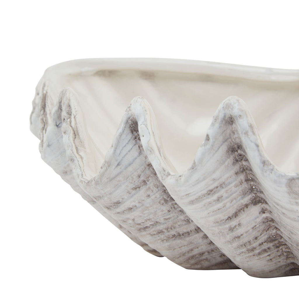 Close-up of the planter's tall scalloped peaks, with grey accents following the shell-like ribs.