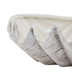 Close-up of the planter's tall scalloped peaks, with grey accents following the shell-like ribs.