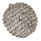 Angled view of the Shingle Orb Decorative Sphere, showing rows of rounded scales and brown patches within the pale distressed finish.