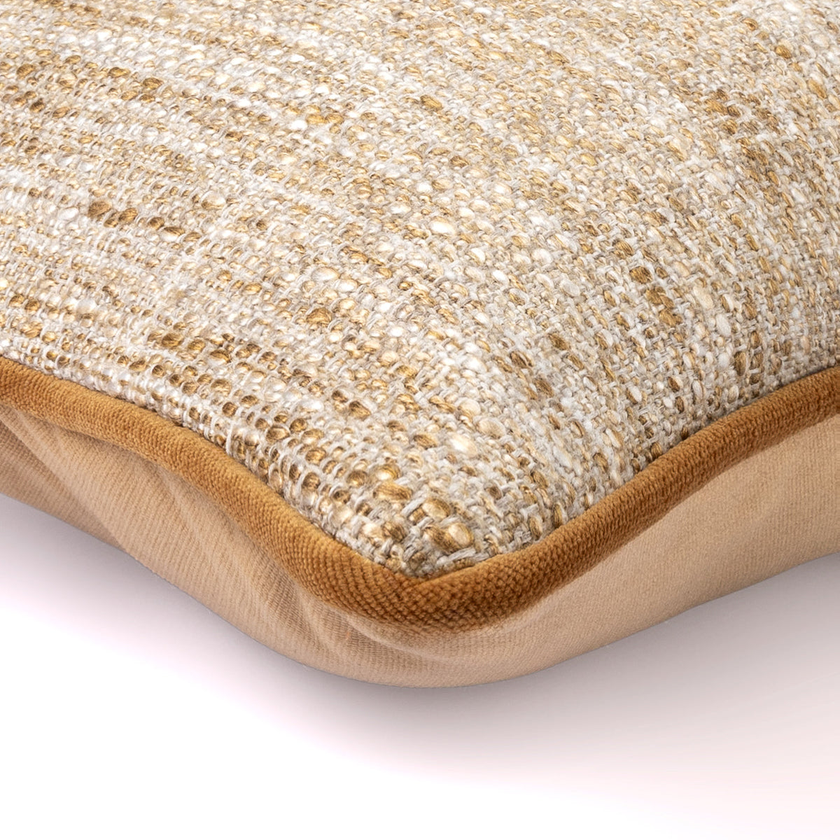 Close-up of the Sienna Weave Cushion showing neutral textured fabric and amber piping