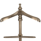 Front close-up of the valet stand's broad curved shoulder hanger, shaped finial and double-rail frame below.