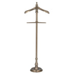 Full front view of an antiqued silver-tone valet stand with a shaped shoulder hanger, tall central post and round stepped base.