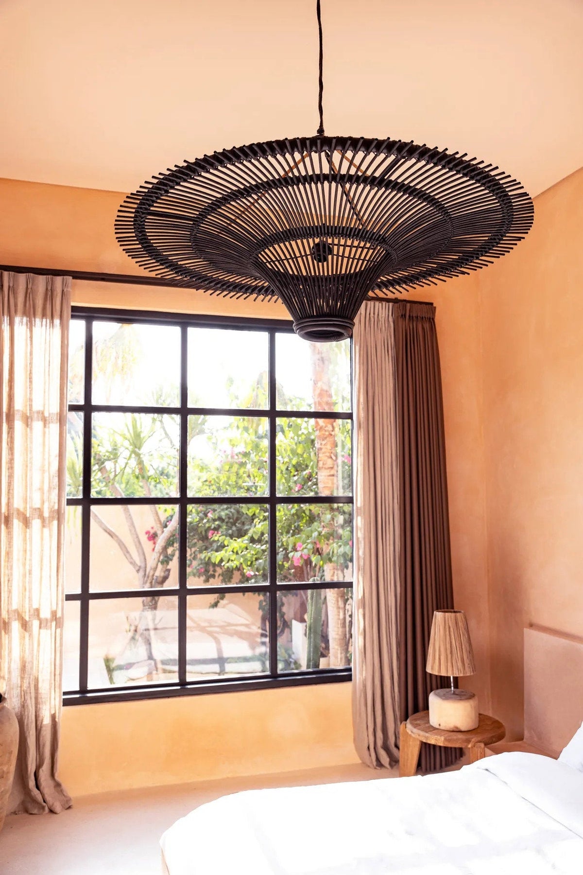 Sky Rattan Pendant Light – Black, Extra Extra Large – ceiling-mounted view in a warm bedroom