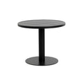 Black round bistro table with a slatted top, single pedestal and circular base on a white background.