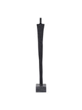 Full front view of a slender black abstract figure sculpture on a grey square base against white.