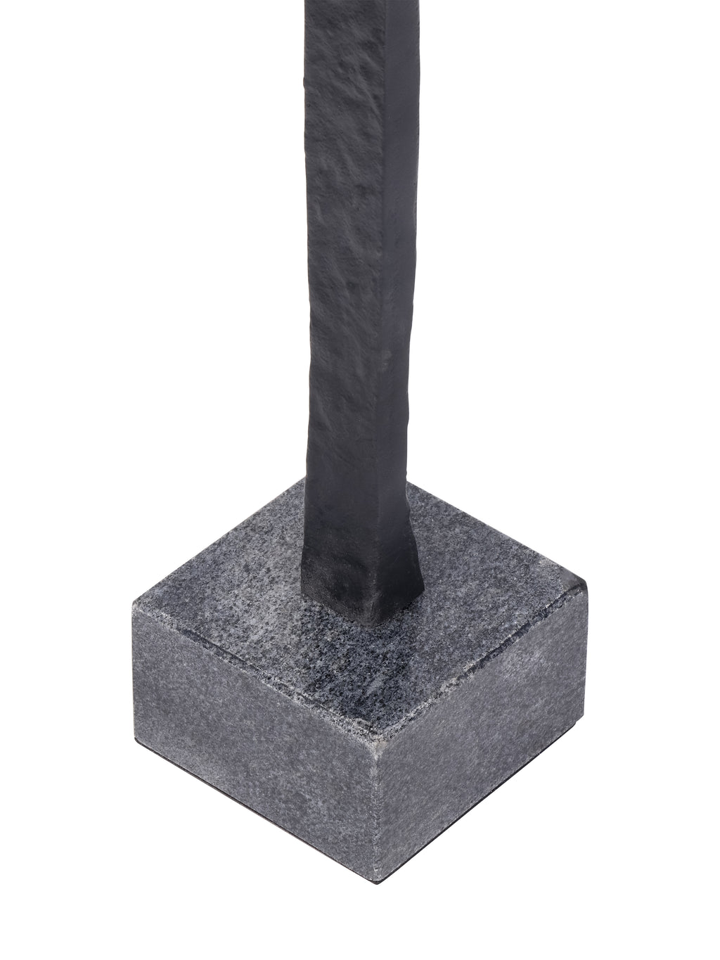 Close-up of the black figure meeting its square grey base with a speckled surface.