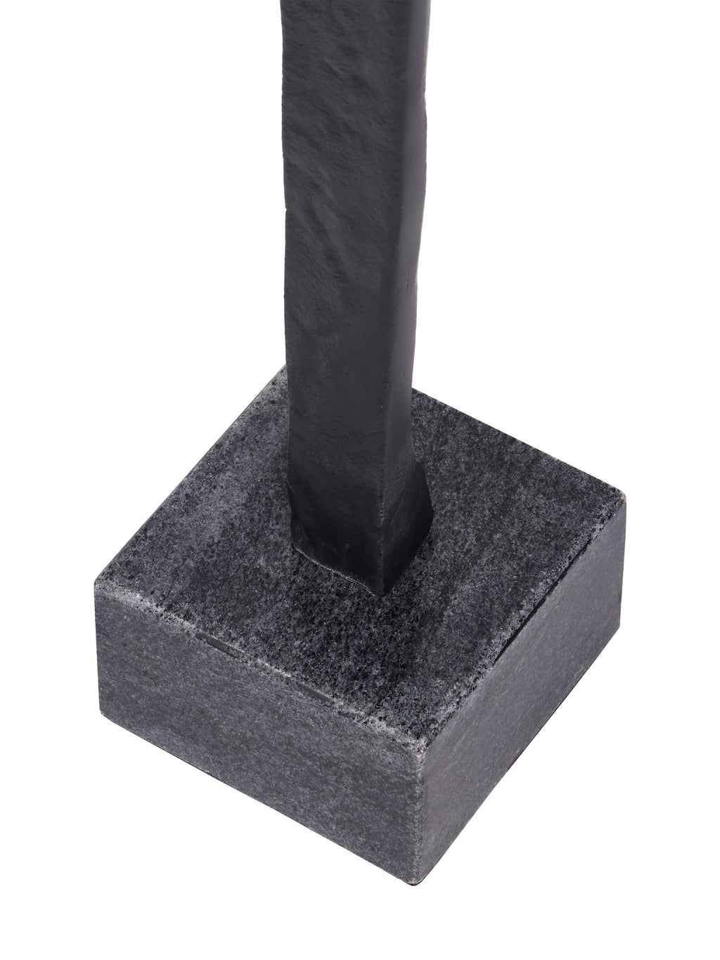 Close-up of the black figure's lower body where it meets the mottled grey square block base.