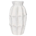 Front view of the slender white vase with softly panelled sides and a gently uneven rim.