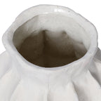 Close view into the vase's opening, showing its undulating white rim and speckled interior.