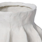 Detail of the white vase's rim and shoulders, with fine speckling and softly raised panel edges.