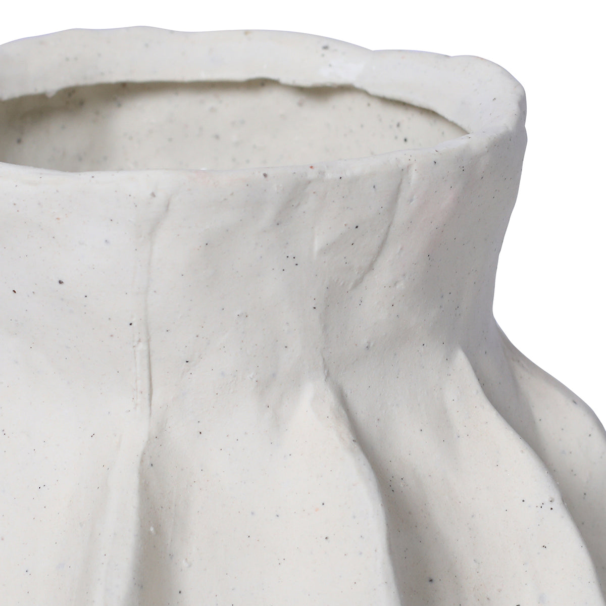 Detail of the white vase's rim and shoulders, with fine speckling and softly raised panel edges.