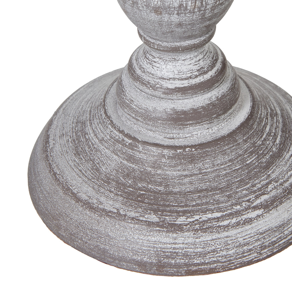 Close-up of the stepped round lamp foot with a rubbed white finish and darker grey-brown colour showing through.