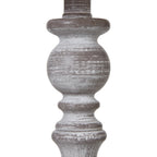 Close-up of the lamp's rounded upper column and curved collars, showing streaks of white over a grey-brown finish.