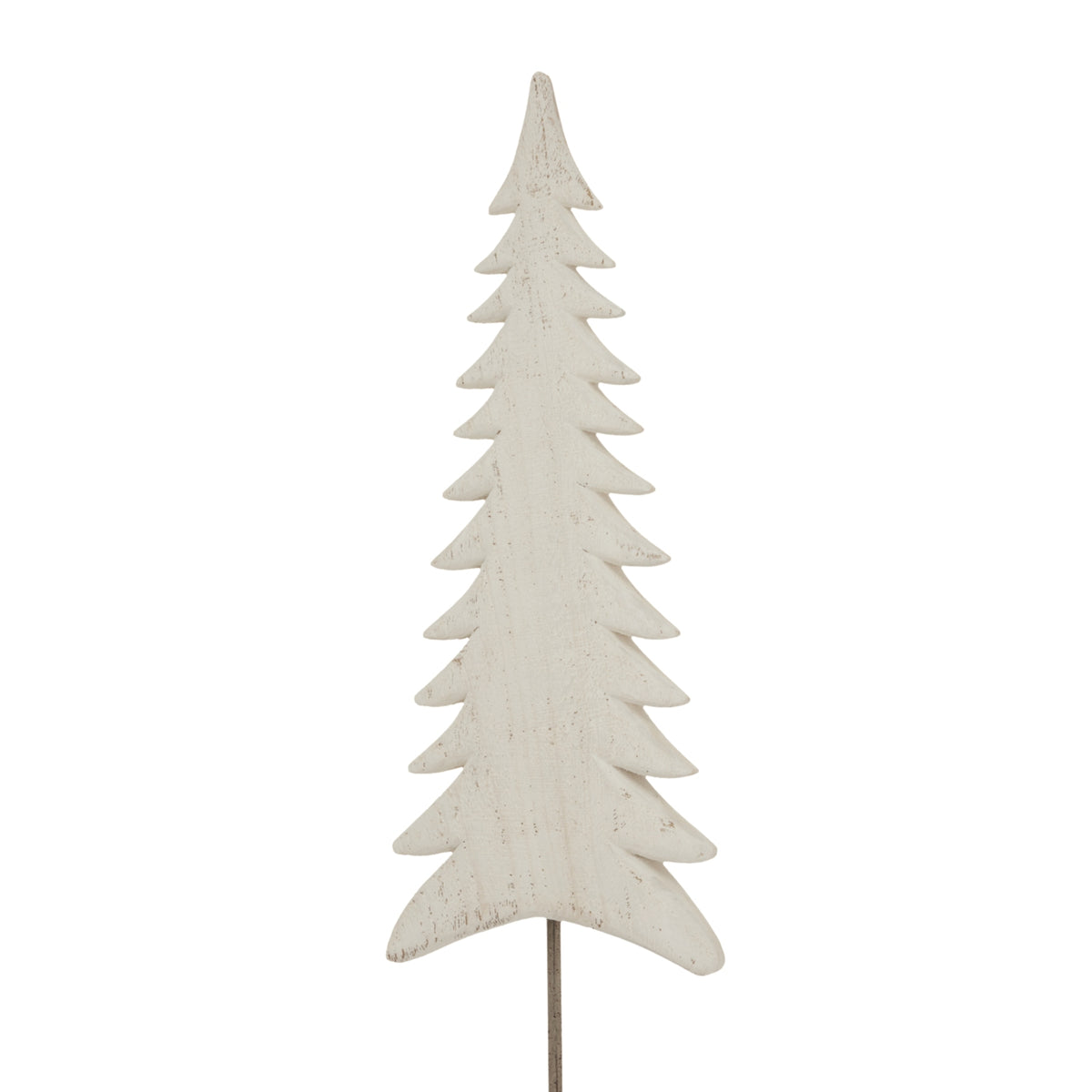 Close view of the pale fir-tree silhouette, showing curved tiered branches and fine darker marks across the whitewashed finish.