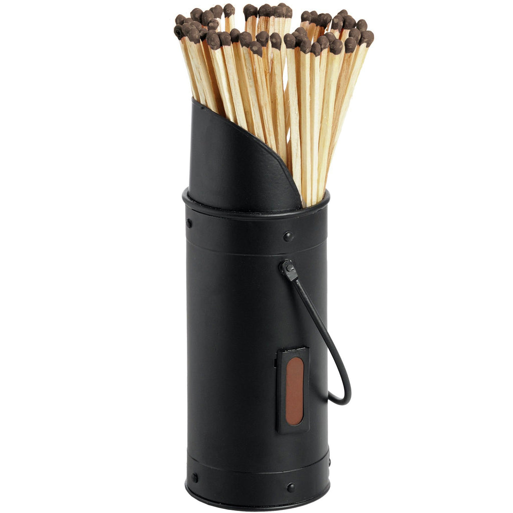 Black cylindrical match holder with a raised sloping mouth, wire loop handle and rust-brown side patch, filled with long pale matches with dark tips.