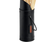 Close-up of the black match holder showing its riveted bands, loop handle, rust-brown rectangular patch and curved edge beneath the matches.