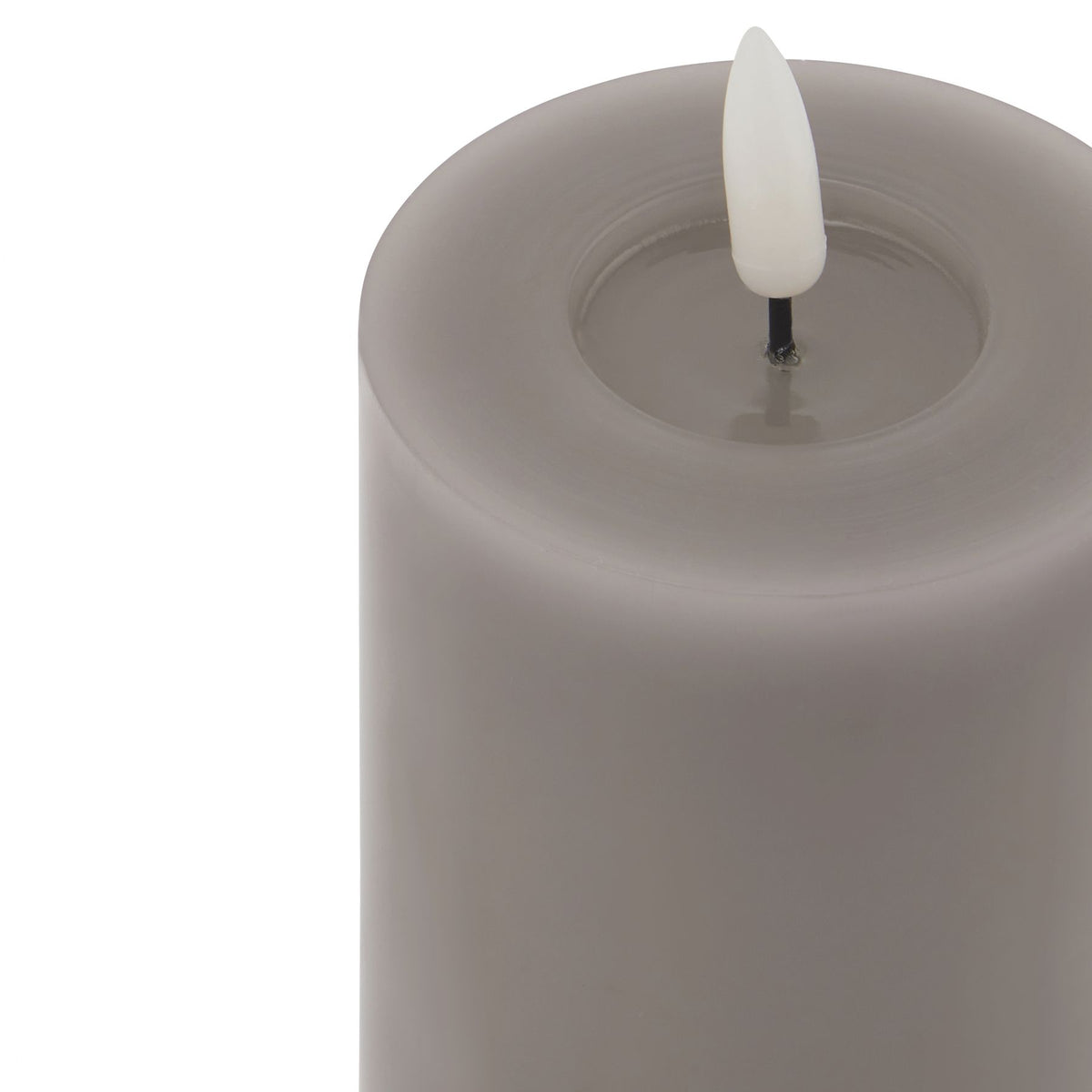 Close-up of the grey candle's broad circular rim and recessed centre, with a white flame insert on a short black stem.