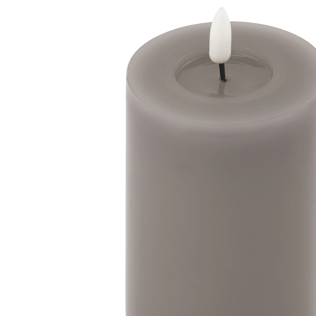 Close-up of the grey candle's broad circular rim and recessed top, with a white flame insert on a short dark stem.