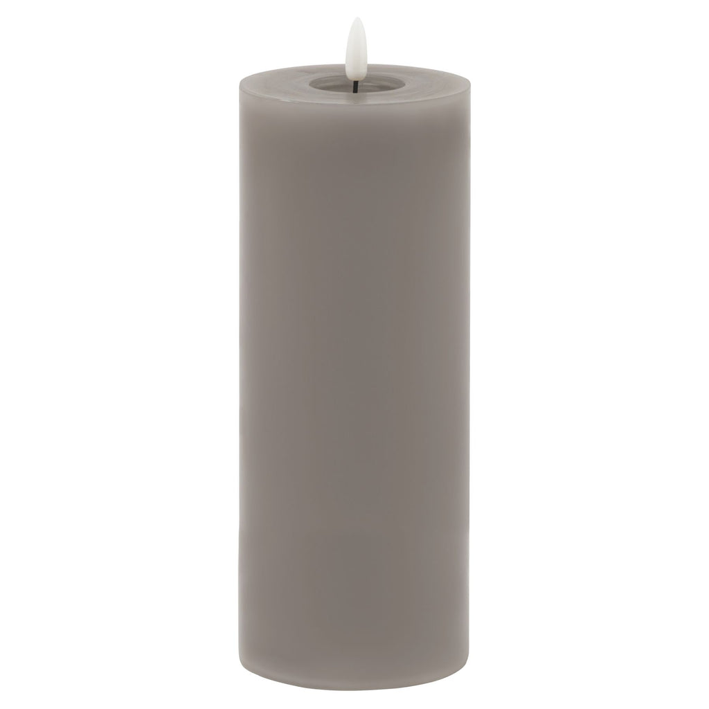 Full view of a tall grey LED pillar candle with smooth straight sides and a white flame-shaped insert above a recessed top.