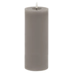 Full view of a tall grey LED pillar candle with smooth straight sides and a white flame-shaped insert above a recessed top.