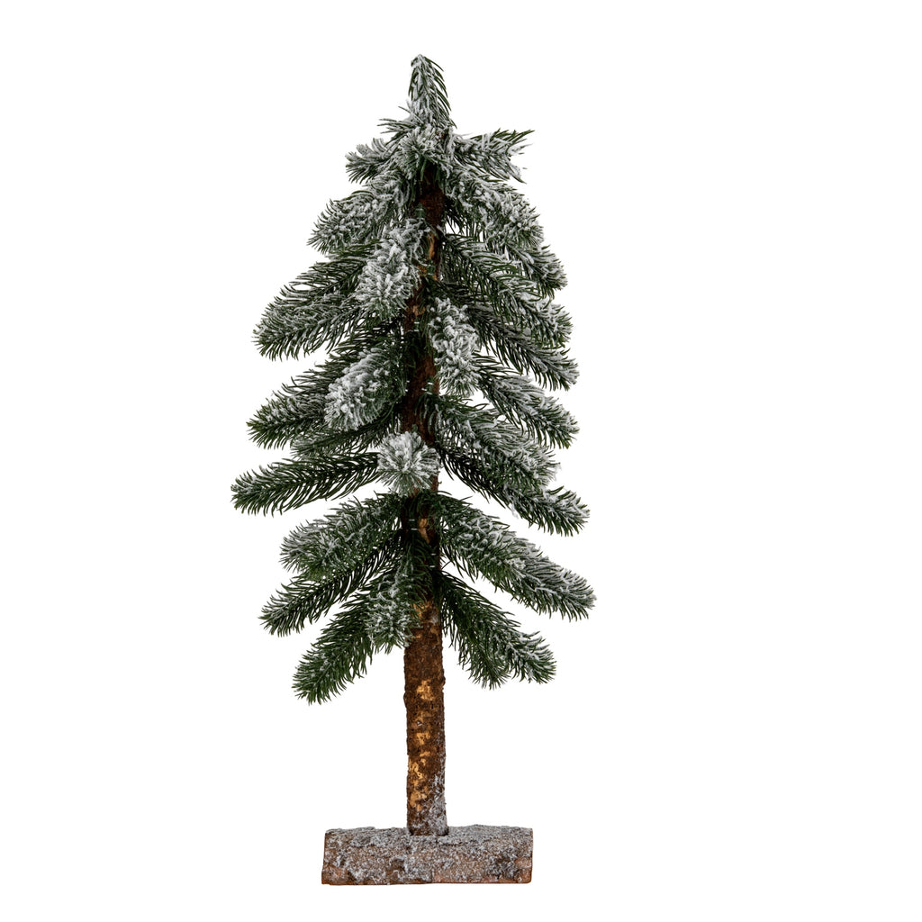 Full view of a narrow decorative pine tree with snowy green branches, an exposed brown trunk and a low rectangular half-log-style base.