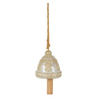 Cream and ochre-brown hanging bell with raised snowflakes, leaf-patterned bands, a long tan cord and a cylindrical wood-look clapper.