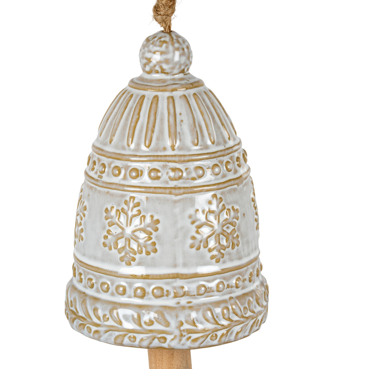 Close-up of the glossy cream bell showing its rounded top, fluted shoulders, raised snowflakes and ochre-brown beaded and leaf-patterned bands.