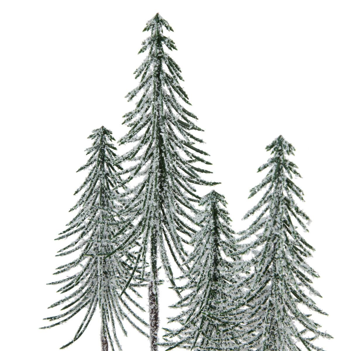 Close-up of the pointed tree tops and fine downward-curving green branches covered with white snow-like flecks.