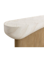 Close-up of the rounded end of the cream travertine-effect top above the light-brown timber-effect base.