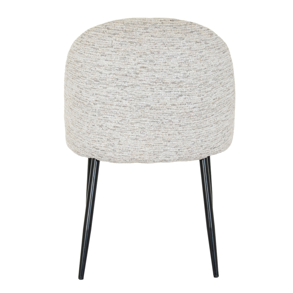Rear view of the dining chair showing its broad rounded pale back and slim black legs against a white background.