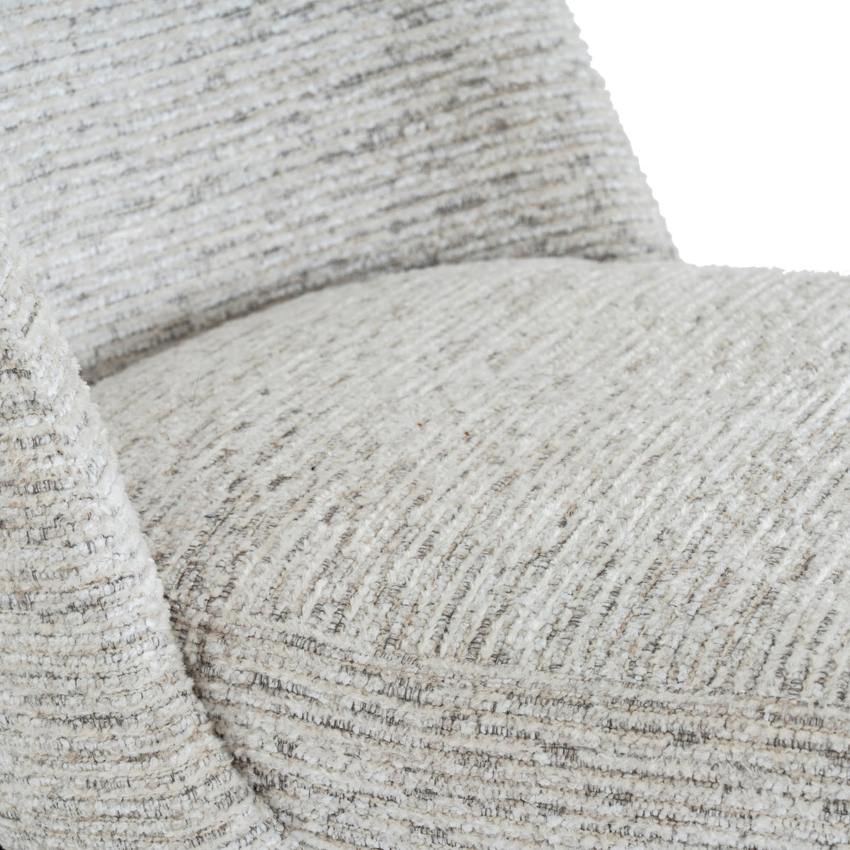 Close-up of the chair's rounded seat and back, showing pale raised texture with fine grey and beige lines.
