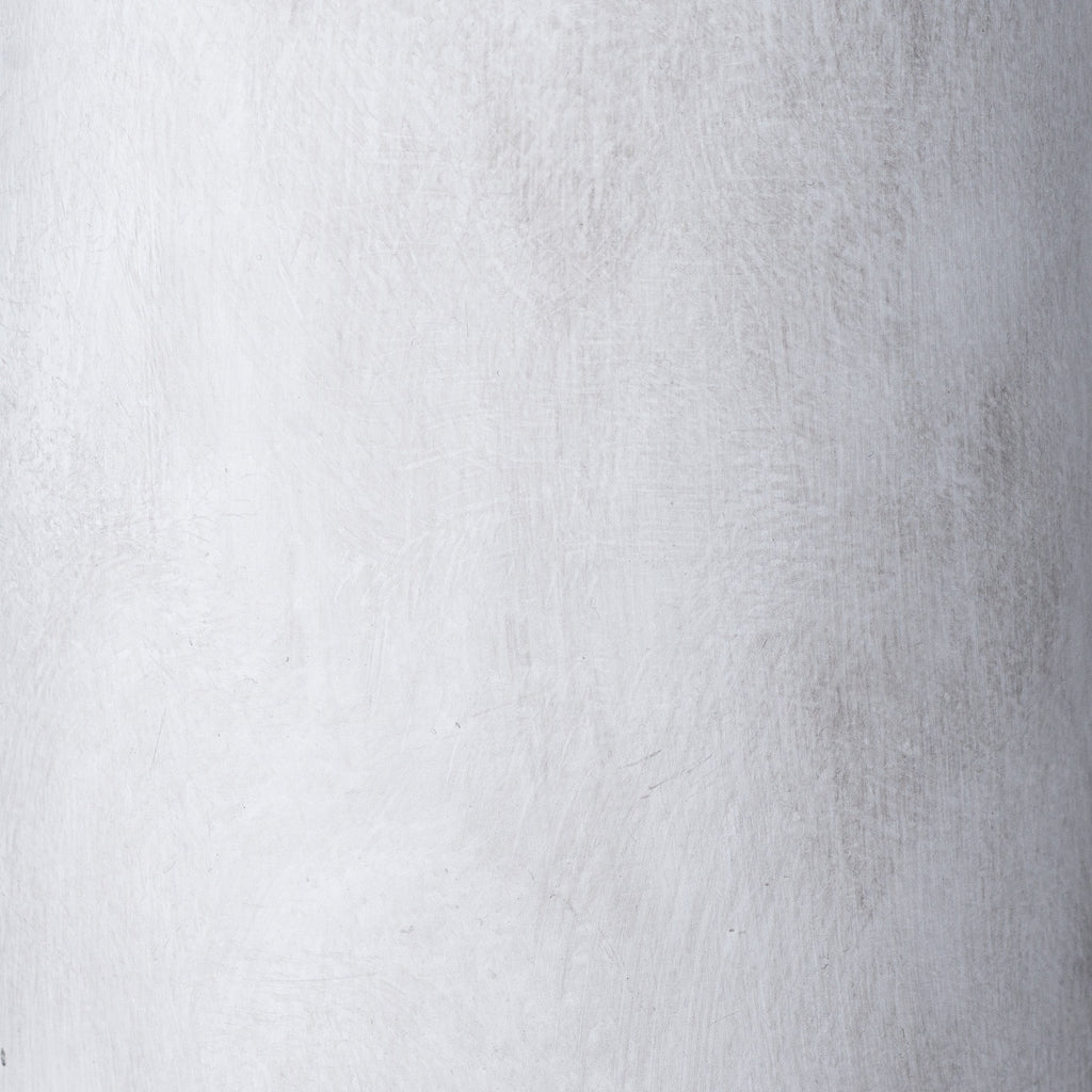 Close-up of the vase's pale grey surface, showing fine texture and soft mottled markings.