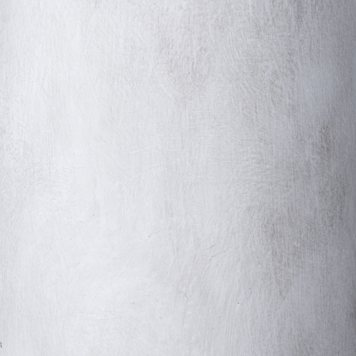 Close-up of the vase's pale grey surface, showing fine texture and soft mottled markings.