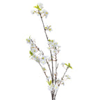 Close view of the artificial spray's upper branches, showing layered white blossoms with pale centres, small buds and pointed green leaves along slender dark-brown stems.