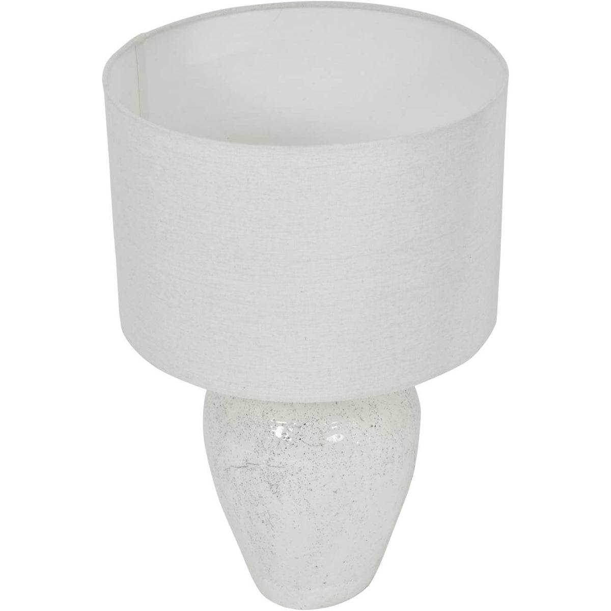 Elevated view of the lamp showing the open top of the drum shade and the tapered speckled base.