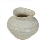 Angled view of the speckled ivory vase showing its wide opening, softly shaped neck and rounded banded body.