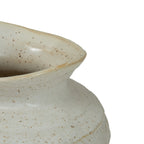 Close-up of the vase's curved, uneven rim and neck, with natural-toned speckles across the ivory glaze.