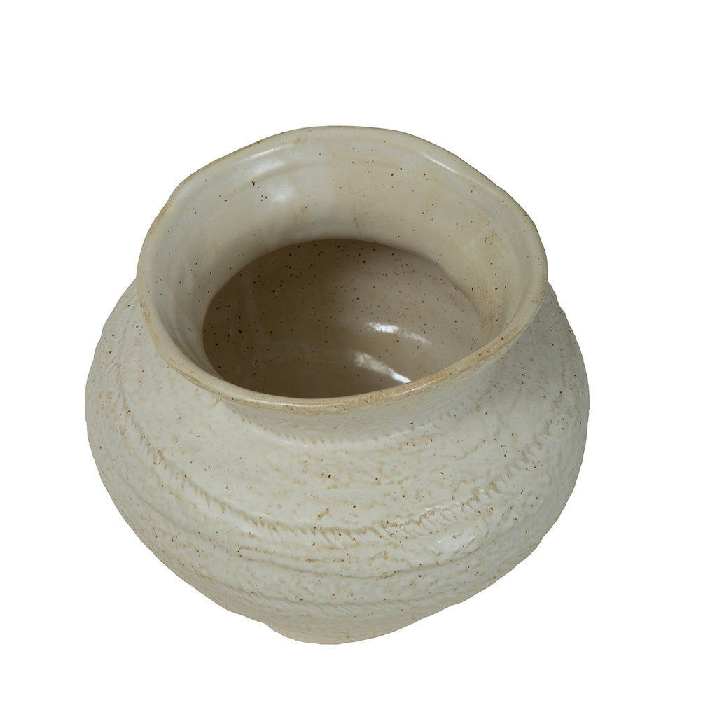 View from above of the vase's uneven rim and open neck, with the glazed interior visible.