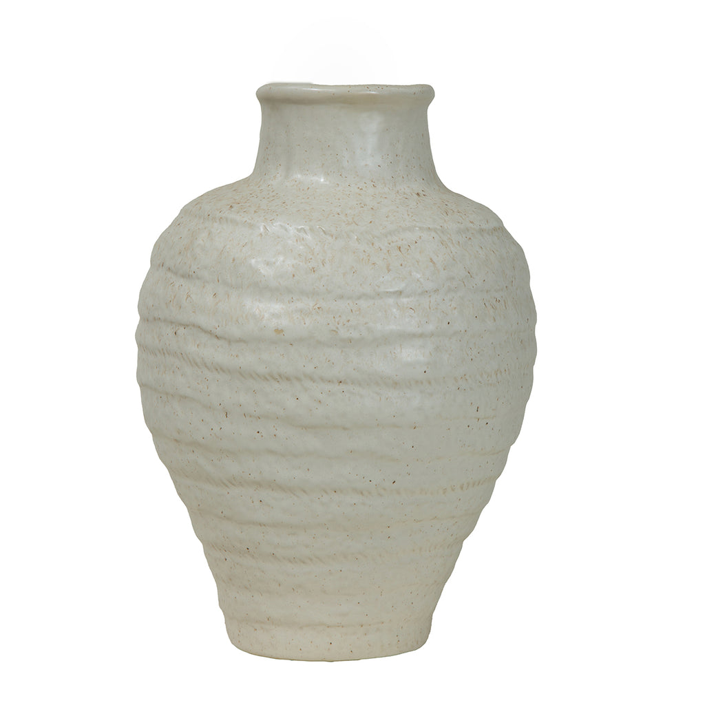 Front view of an ivory speckled vase with a rounded, horizontally banded body tapering towards the base.