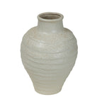Angled view of the speckled ivory vase showing its open short neck, rolled rim and textured shoulders.