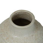 View down into the vase opening, showing the rounded rolled rim and speckled glaze inside the neck.